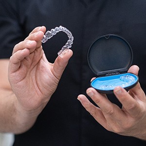 Patient holding clear aligner