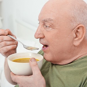 A man eating soup