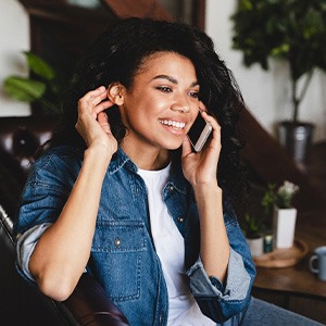 Woman smiling while talking on phone