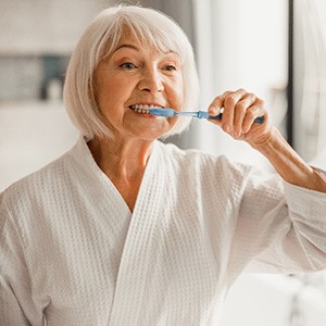 A woman brushing her teeth