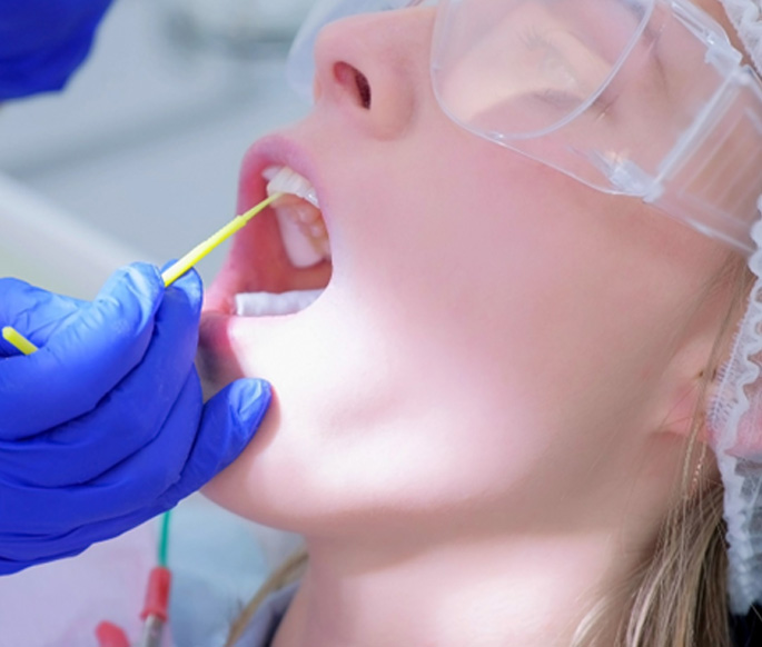 Girl receiving fluoride