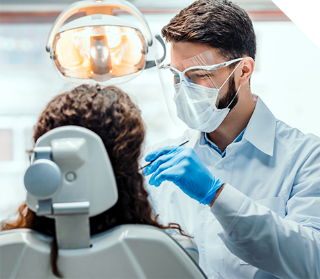 Dentist performing a dental procedure on a patient