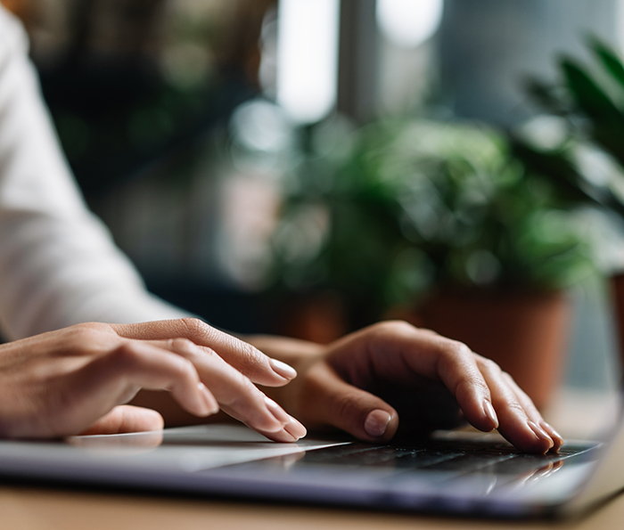 Person typing on a laptop
