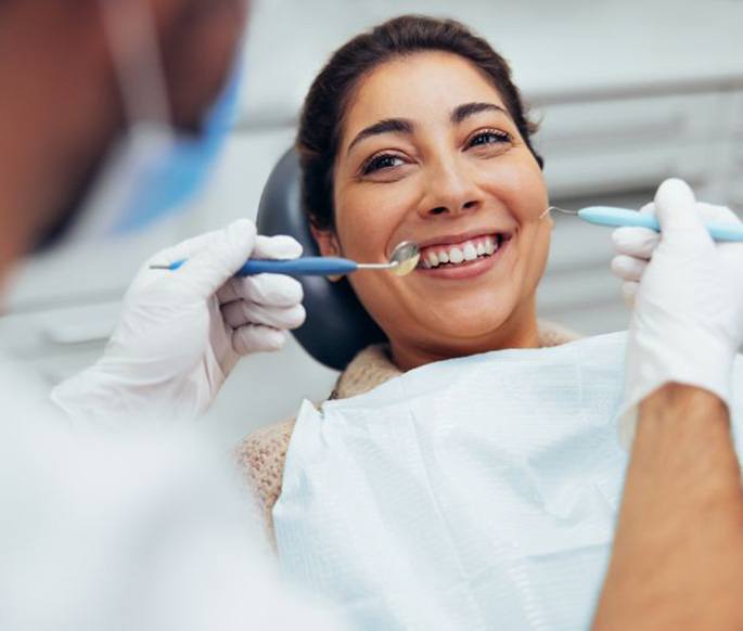 Patient smiling during her dental checkup