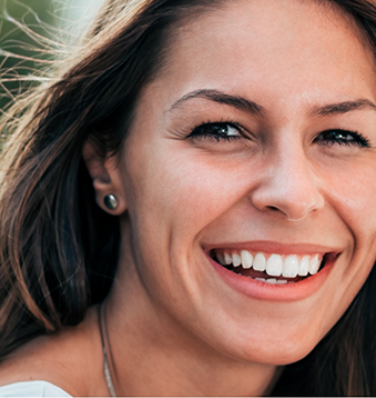 Woman with straight brown hair smiling