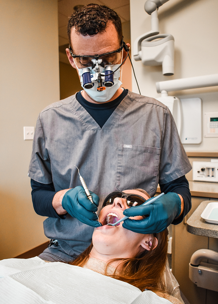 Doctor Kelly giving a patient a dental exam