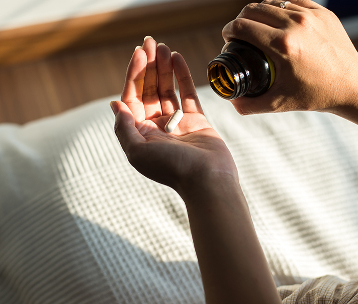 Person taking a pill