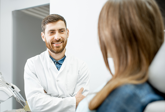 Dentist talking with a patient about tooth extractions in Salmon Creek
