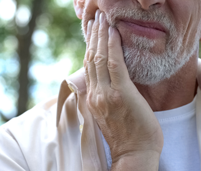 Closeup of patient with jaw pain