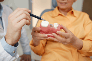 a patient during their dental implant consultation